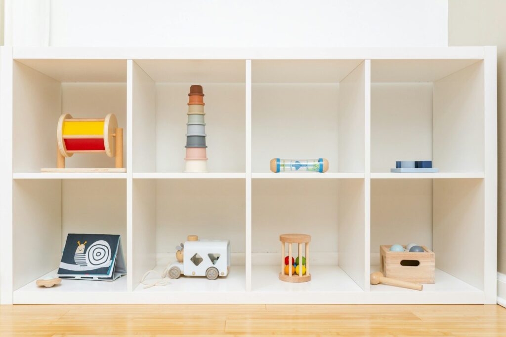 a shelf filled with lots of different types of toys